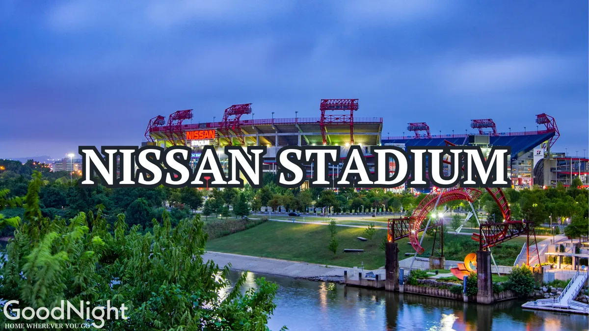 This exterior photo highlights Nissan Stadium along the riverfront, surrounded by green parks and walking paths. The vibrant setting features the cityscape in the background, illustrating a lively area for sports events, picnics, and outdoor adventures.